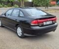 Черный Мазда 626, объемом двигателя 2.5 л и пробегом 190 тыс. км за 2800 $, фото 1 на Automoto.ua