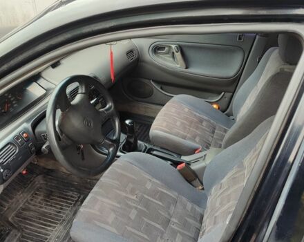 Черный Мазда 626, объемом двигателя 2 л и пробегом 573 тыс. км за 1100 $, фото 4 на Automoto.ua