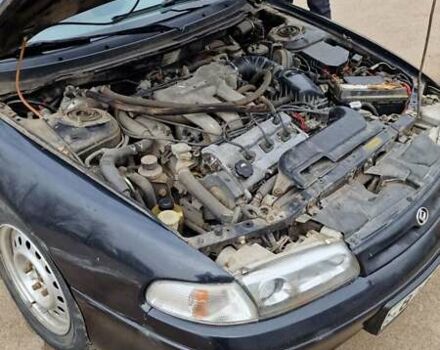 Черный Мазда 626, объемом двигателя 2.5 л и пробегом 380 тыс. км за 1500 $, фото 3 на Automoto.ua