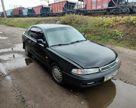 Черный Мазда 626, объемом двигателя 2 л и пробегом 573 тыс. км за 1100 $, фото 1 на Automoto.ua