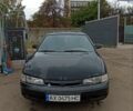 Черный Мазда 626, объемом двигателя 1.8 л и пробегом 200 тыс. км за 1800 $, фото 1 на Automoto.ua