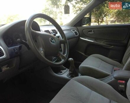 Черный Мазда 626, объемом двигателя 1.8 л и пробегом 316 тыс. км за 2700 $, фото 2 на Automoto.ua