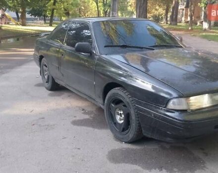 Черный Мазда 626, объемом двигателя 2.2 л и пробегом 400 тыс. км за 1200 $, фото 1 на Automoto.ua