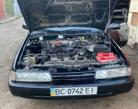 Черный Мазда 626, объемом двигателя 2.2 л и пробегом 280 тыс. км за 1900 $, фото 2 на Automoto.ua