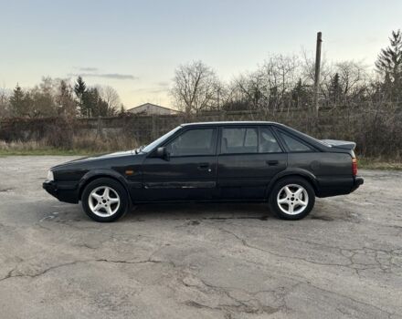 Черный Мазда 626, объемом двигателя 2 л и пробегом 420 тыс. км за 1300 $, фото 1 на Automoto.ua