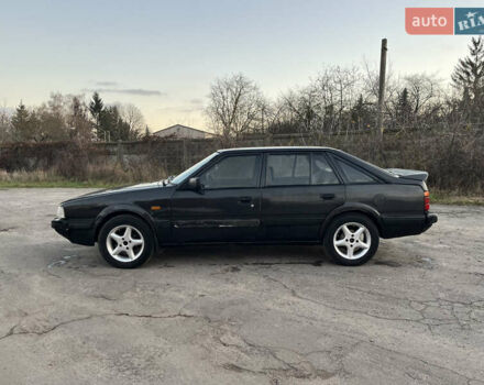 Черный Мазда 626, объемом двигателя 2 л и пробегом 420 тыс. км за 1300 $, фото 2 на Automoto.ua