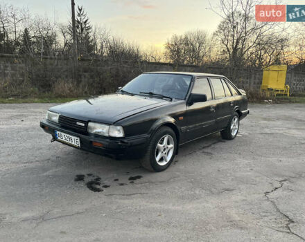 Черный Мазда 626, объемом двигателя 2 л и пробегом 420 тыс. км за 1300 $, фото 1 на Automoto.ua