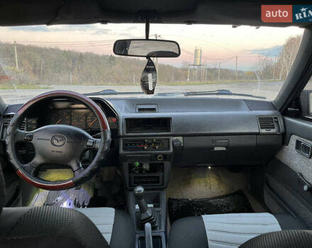 Черный Мазда 626, объемом двигателя 2 л и пробегом 420 тыс. км за 1300 $, фото 7 на Automoto.ua