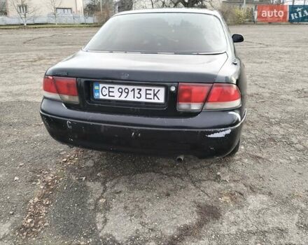 Черный Мазда 626, объемом двигателя 2 л и пробегом 410 тыс. км за 1650 $, фото 5 на Automoto.ua