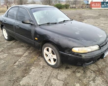 Черный Мазда 626, объемом двигателя 2 л и пробегом 410 тыс. км за 1650 $, фото 1 на Automoto.ua