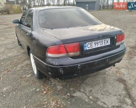 Черный Мазда 626, объемом двигателя 2 л и пробегом 410 тыс. км за 1650 $, фото 6 на Automoto.ua