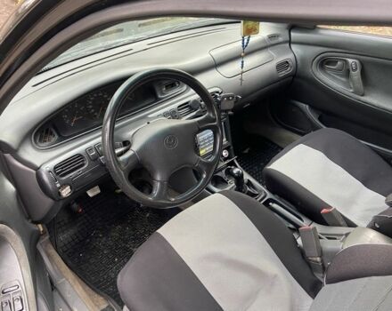 Черный Мазда 626, объемом двигателя 2 л и пробегом 300 тыс. км за 1150 $, фото 3 на Automoto.ua