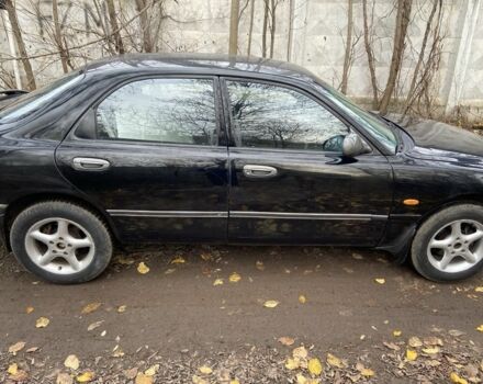 Черный Мазда 626, объемом двигателя 2 л и пробегом 300 тыс. км за 1150 $, фото 11 на Automoto.ua