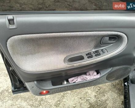 Черный Мазда 626, объемом двигателя 2 л и пробегом 410 тыс. км за 1650 $, фото 9 на Automoto.ua