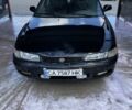 Черный Мазда 626, объемом двигателя 1.8 л и пробегом 250 тыс. км за 793 $, фото 1 на Automoto.ua