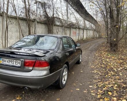 Черный Мазда 626, объемом двигателя 2 л и пробегом 300 тыс. км за 1150 $, фото 7 на Automoto.ua