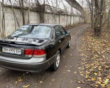 Черный Мазда 626, объемом двигателя 2 л и пробегом 300 тыс. км за 1150 $, фото 14 на Automoto.ua