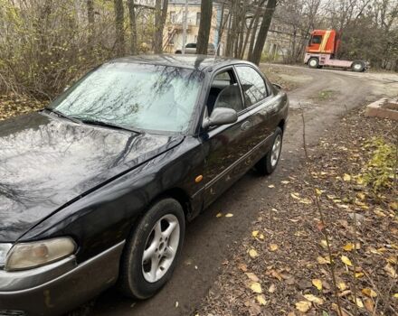 Черный Мазда 626, объемом двигателя 2 л и пробегом 300 тыс. км за 1150 $, фото 4 на Automoto.ua