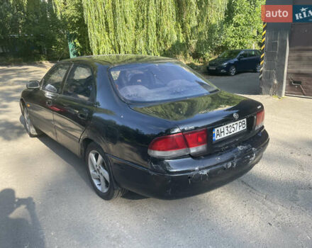 Черный Мазда 626, объемом двигателя 2 л и пробегом 380 тыс. км за 1200 $, фото 5 на Automoto.ua