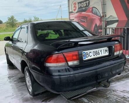 Черный Мазда 626, объемом двигателя 2 л и пробегом 345 тыс. км за 1650 $, фото 1 на Automoto.ua