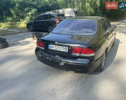 Черный Мазда 626, объемом двигателя 2 л и пробегом 380 тыс. км за 1200 $, фото 4 на Automoto.ua