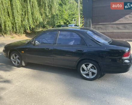Черный Мазда 626, объемом двигателя 2 л и пробегом 380 тыс. км за 1200 $, фото 6 на Automoto.ua
