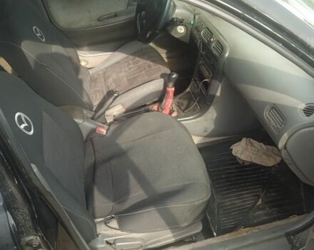 Черный Мазда 626, объемом двигателя 0 л и пробегом 300 тыс. км за 1069 $, фото 4 на Automoto.ua