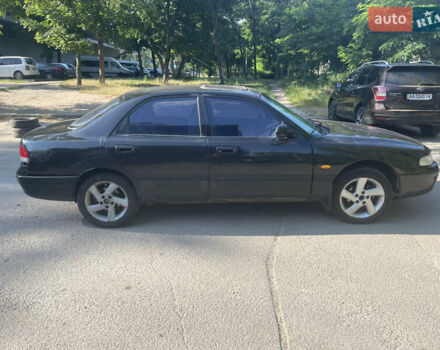 Черный Мазда 626, объемом двигателя 2 л и пробегом 380 тыс. км за 1200 $, фото 3 на Automoto.ua
