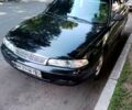 Черный Мазда 626, объемом двигателя 1.8 л и пробегом 270 тыс. км за 2300 $, фото 1 на Automoto.ua