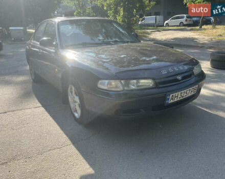 Черный Мазда 626, объемом двигателя 2 л и пробегом 380 тыс. км за 1200 $, фото 1 на Automoto.ua