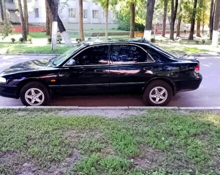 Черный Мазда 626, объемом двигателя 1.8 л и пробегом 270 тыс. км за 2300 $, фото 1 на Automoto.ua