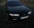 Черный Мазда 626, объемом двигателя 2 л и пробегом 386 тыс. км за 1200 $, фото 1 на Automoto.ua