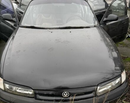 Черный Мазда 626, объемом двигателя 1.8 л и пробегом 390 тыс. км за 993 $, фото 1 на Automoto.ua