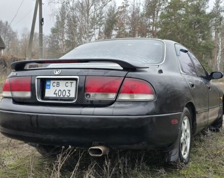 Черный Мазда 626, объемом двигателя 2 л и пробегом 250 тыс. км за 1500 $, фото 3 на Automoto.ua