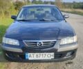 Черный Мазда 626, объемом двигателя 2 л и пробегом 260 тыс. км за 2700 $, фото 1 на Automoto.ua