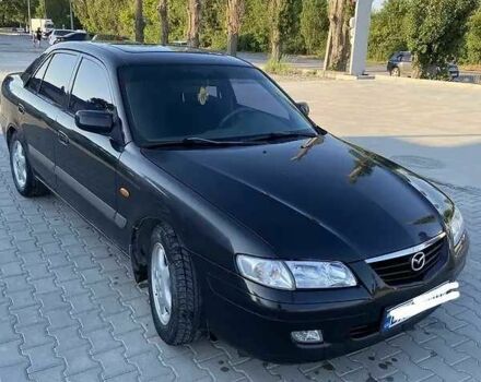 Черный Мазда 626, объемом двигателя 2 л и пробегом 210 тыс. км за 3000 $, фото 1 на Automoto.ua