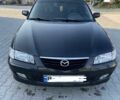 Черный Мазда 626, объемом двигателя 2 л и пробегом 210 тыс. км за 3000 $, фото 1 на Automoto.ua