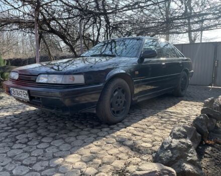 Черный Мазда 626, объемом двигателя 2 л и пробегом 320 тыс. км за 950 $, фото 1 на Automoto.ua