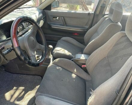 Черный Мазда 626, объемом двигателя 2 л и пробегом 320 тыс. км за 950 $, фото 8 на Automoto.ua