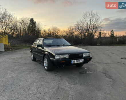 Черный Мазда 626, объемом двигателя 2 л и пробегом 420 тыс. км за 1300 $, фото 1 на Automoto.ua