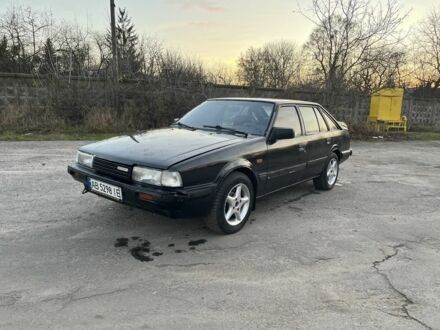 Черный Мазда 626, объемом двигателя 2 л и пробегом 420 тыс. км за 1300 $, фото 1 на Automoto.ua