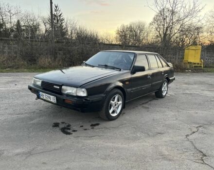 Черный Мазда 626, объемом двигателя 2 л и пробегом 420 тыс. км за 1300 $, фото 1 на Automoto.ua