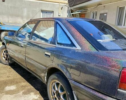 Чорний Мазда 626, об'ємом двигуна 2 л та пробігом 100 тис. км за 1000 $, фото 1 на Automoto.ua