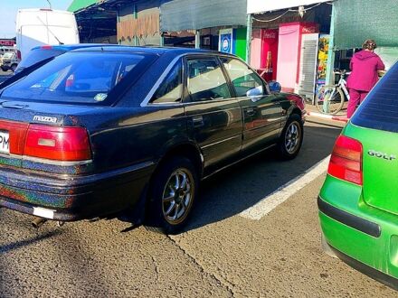 Чорний Мазда 626, об'ємом двигуна 2 л та пробігом 300 тис. км за 1100 $, фото 1 на Automoto.ua