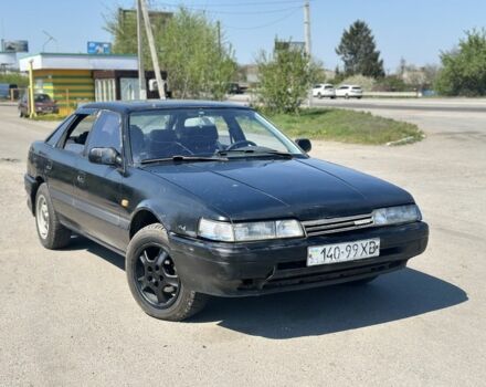 Черный Мазда 626, объемом двигателя 2 л и пробегом 300 тыс. км за 699 $, фото 1 на Automoto.ua