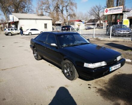 Черный Мазда 626, объемом двигателя 2 л и пробегом 535 тыс. км за 1700 $, фото 1 на Automoto.ua