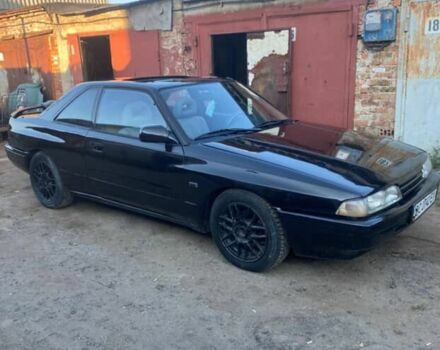 Черный Мазда 626, объемом двигателя 2.2 л и пробегом 280 тыс. км за 1900 $, фото 1 на Automoto.ua