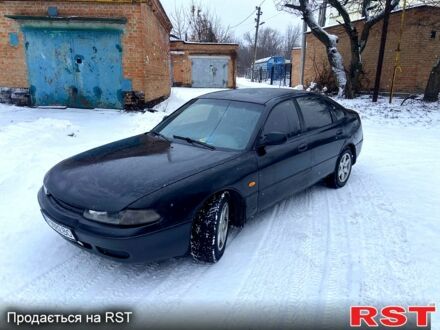 Черный Мазда 626, объемом двигателя 2 л и пробегом 516 тыс. км за 1500 $, фото 1 на Automoto.ua