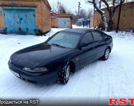 Черный Мазда 626, объемом двигателя 2 л и пробегом 516 тыс. км за 1500 $, фото 1 на Automoto.ua