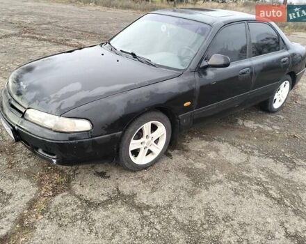 Черный Мазда 626, объемом двигателя 2 л и пробегом 410 тыс. км за 1650 $, фото 1 на Automoto.ua